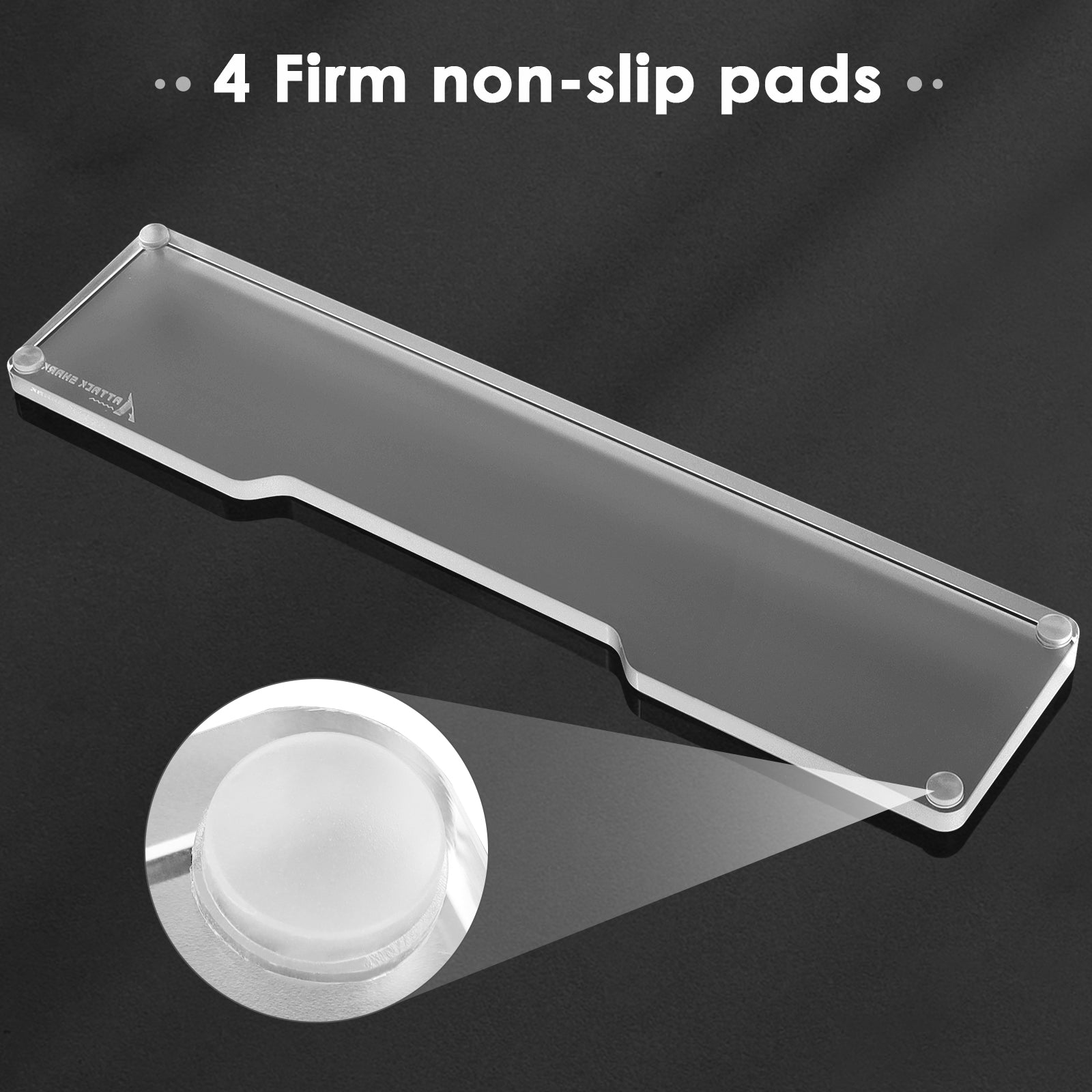 Close-up of clear acrylic wrist rest showing four firm anti-slip pads for stability.
