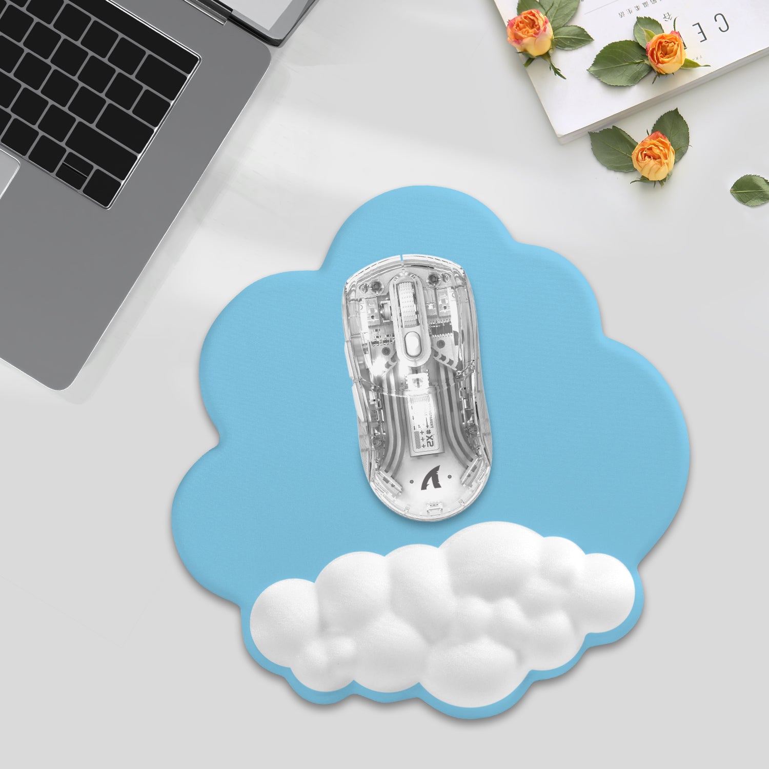 Light blue cloud mouse pad with ergonomic wrist rest and gaming mouse for smooth tracking.