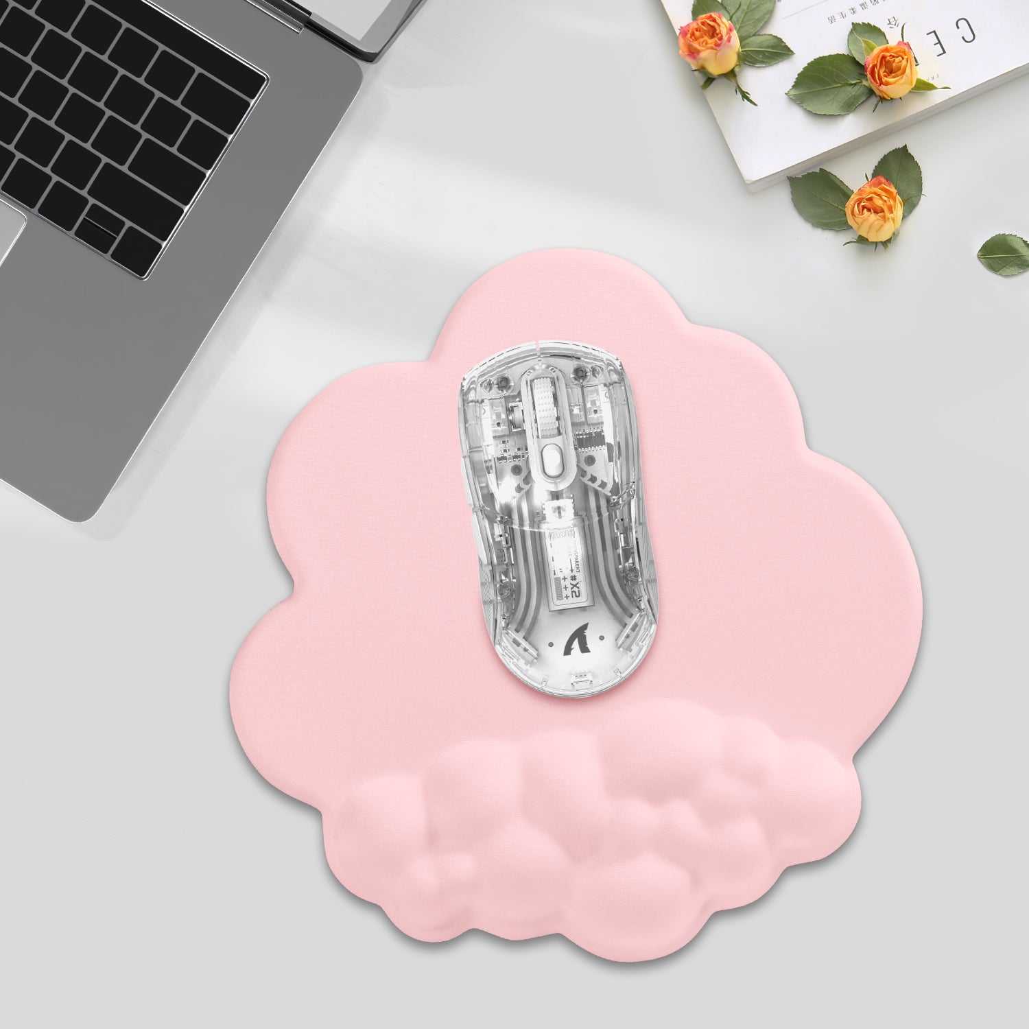 Pink cloud mouse pad with ergonomic wrist rest and transparent gaming mouse for precise tracking.