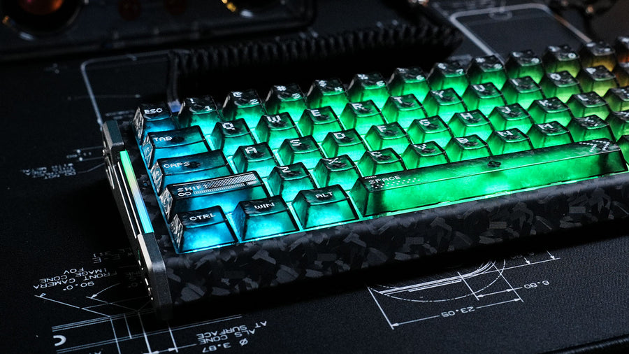 Mechanical keyboard with forged carbon fiber case and glowing green translucent keycaps.