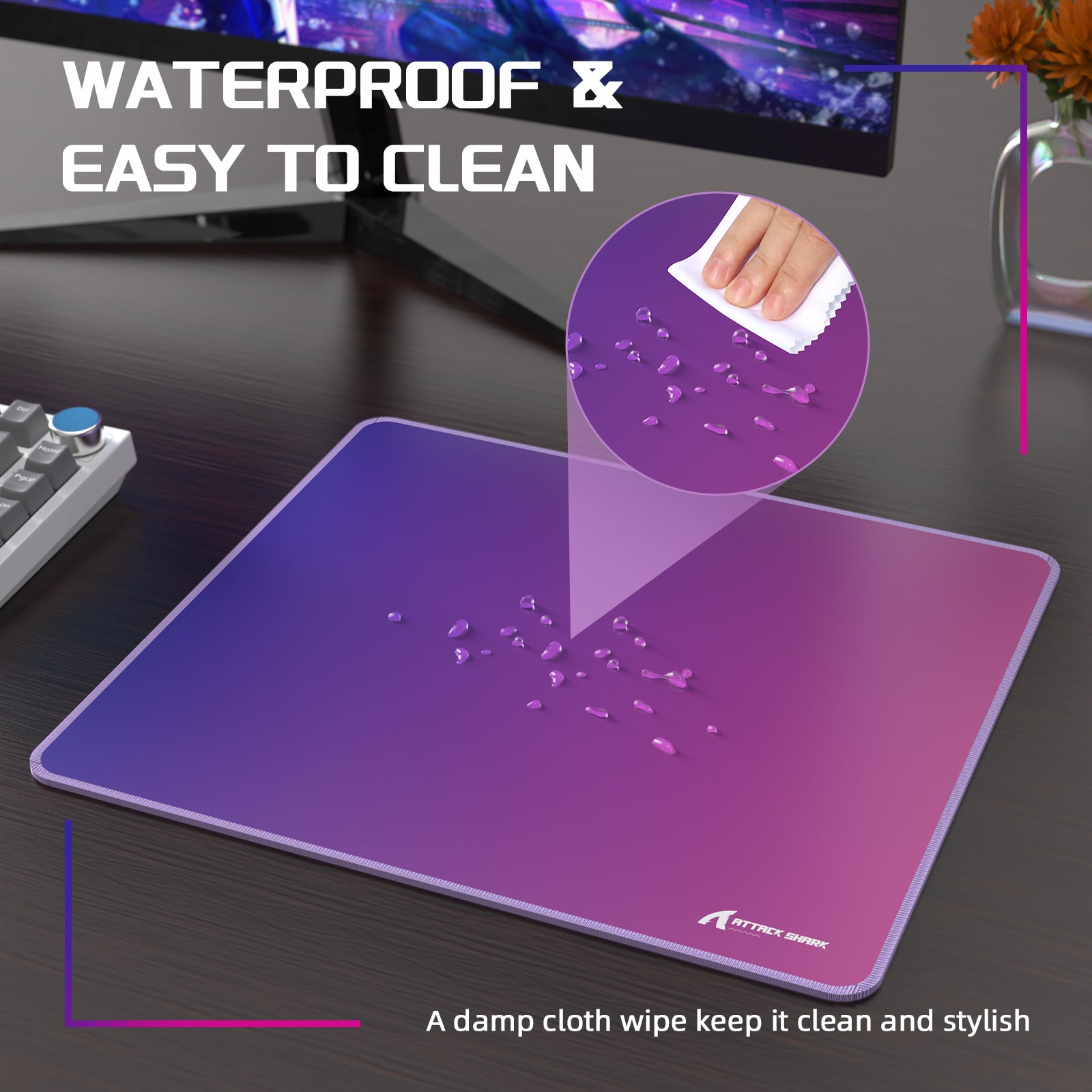 Water-resistant Attack Shark CM03 mouse pad demonstrating easy cleaning with droplets